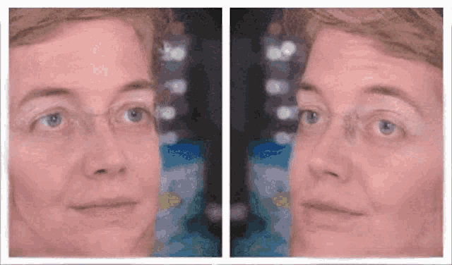 a woman wearing glasses is looking at herself in the mirror and smiling .