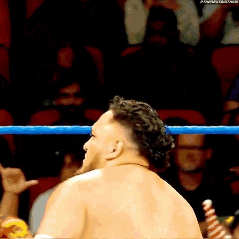 a man in a wrestling ring with the next big thing written on the bottom right
