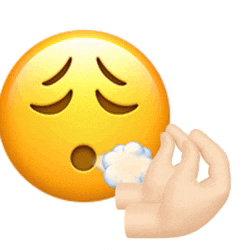 a hand is reaching out towards a smiley face with closed eyes