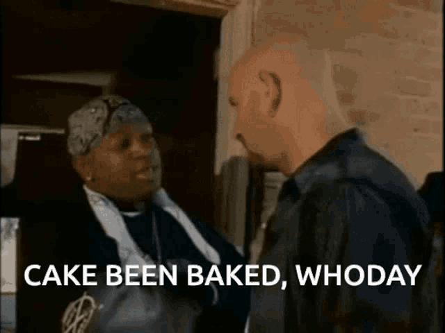 a man and a woman are standing next to each other and the woman says cake been baked whoday .