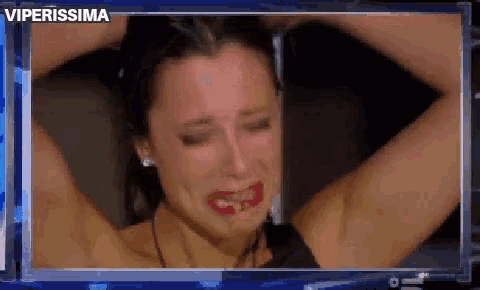a woman is crying with red lipstick on her face and the word viperissima is above her