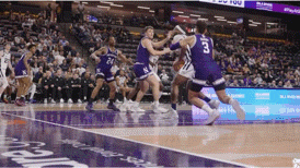 a basketball game is being played in a stadium with a sign that says ' nba ' on it