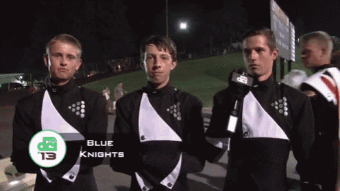 three men in black and white uniforms are standing next to each other and the word blue knights is on the front