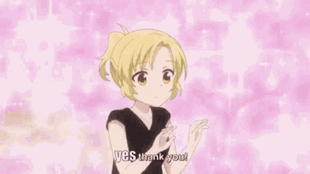 a girl in a black shirt is holding a heart in her hand and saying `` yes thank you '' .
