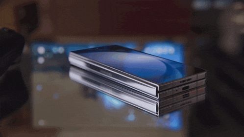 a galaxy z fold5 phone is displayed on a glass surface
