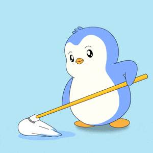 a blue and white penguin is holding a mop in its hand