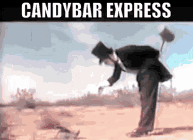 a man in a top hat is standing in the desert with the words candybar express below him