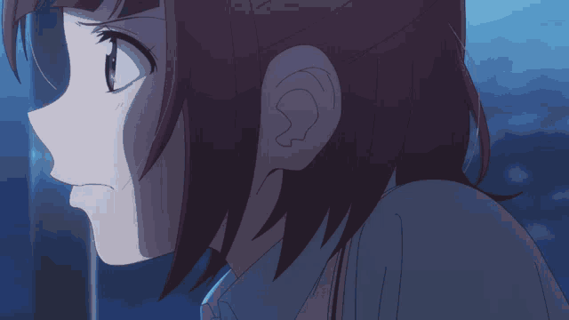 a close up of a girl 's ear with a blue background