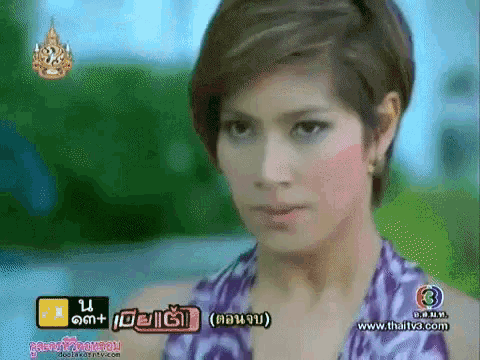 a close up of a woman 's face with the number 3 on the bottom right corner