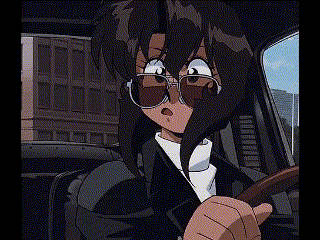 a woman is sitting in a car wearing sunglasses and a suit .