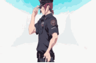 a man in a police uniform is standing in front of a white wall .