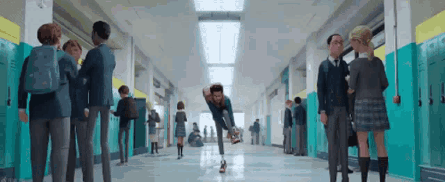 a man is jumping in the air in a school hallway .