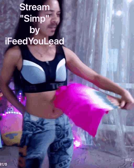 a woman in a crop top is holding a pink cloth and says stream simp by ifeedyoulead on the bottom