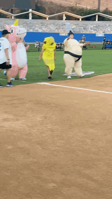 a sumo wrestler and a unicorn are walking on a baseball field