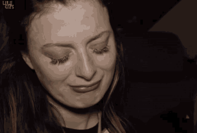 a close up of a woman 's face with the words liuji gifs visible