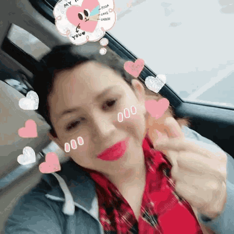 a woman in a car with hearts around her face and a balloon that says my heart is yours
