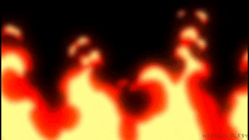 a blurred image of a fire flame on a black background .