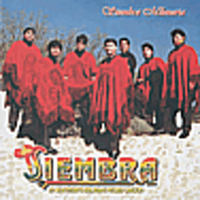 a group of people in red robes are standing in the snow on a album cover .