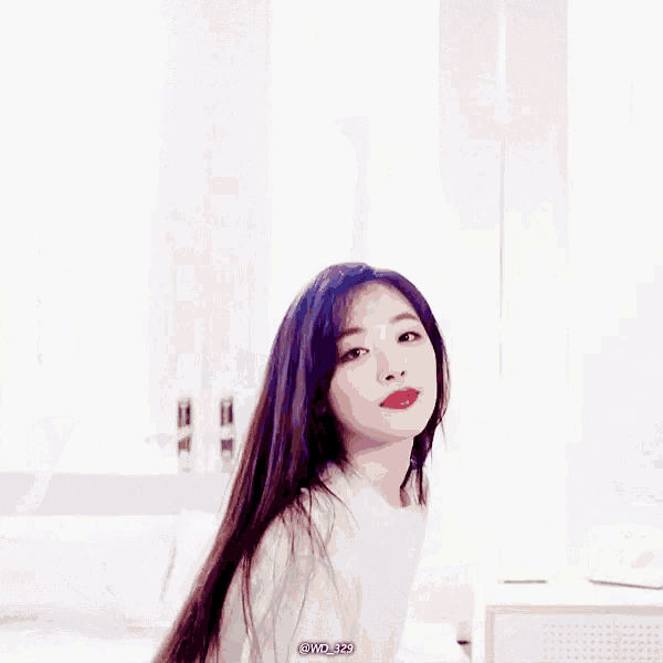 a woman with purple hair and red lips is standing in front of a window with a watermark that says @ mojpa2