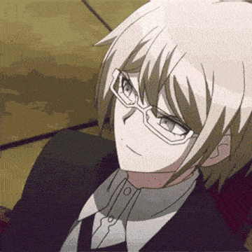 a close up of a man wearing glasses and a suit .