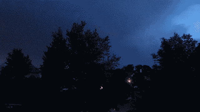 a sunset with trees in the foreground and a purple sky in the background