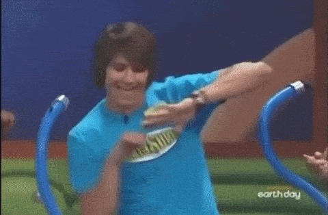 a man is wearing a blue shirt that says earth day on it