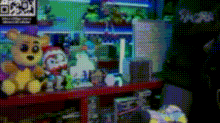 a bunch of stuffed animals are sitting on a shelf in a dark room .