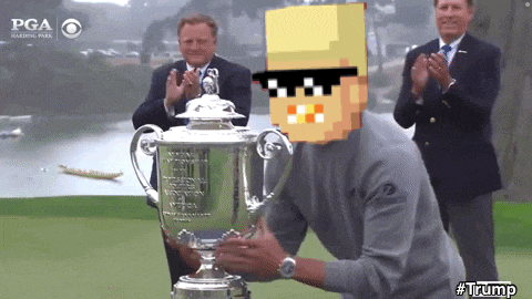 a man holding a trophy that says pga on the bottom right