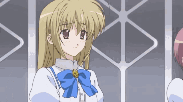 a girl with blonde hair and a blue bow on her neck