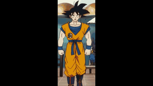 goku from dragon ball z is standing in a room wearing a yellow and blue costume