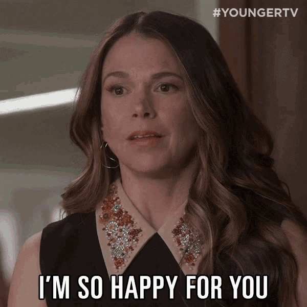 a woman says " i 'm so happy for you " while wearing a black top