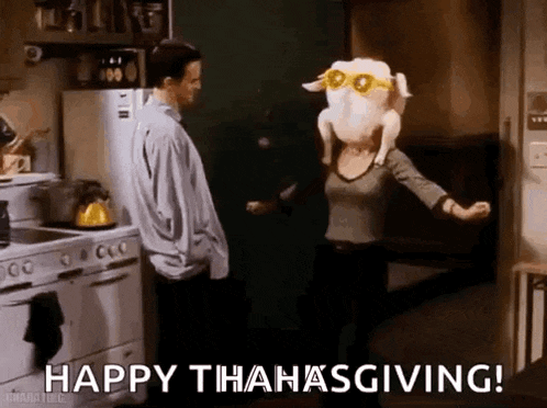 a man and a woman are dancing in a kitchen with a turkey on their heads .