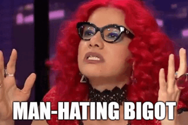 a woman with red hair and glasses is saying man-hating bigot