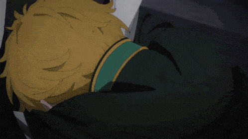 a close up of a person laying down with their head on someone 's chest