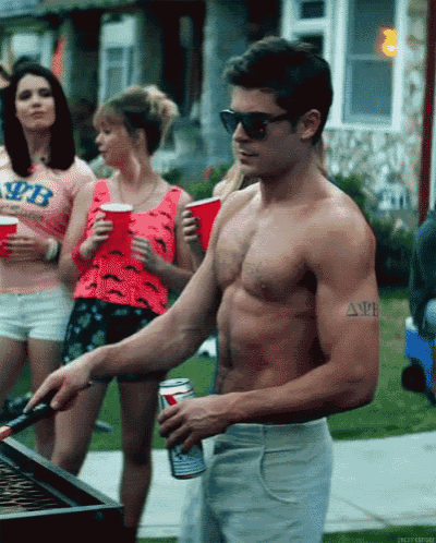 a shirtless man with a tattoo on his arm that says a.p.b.