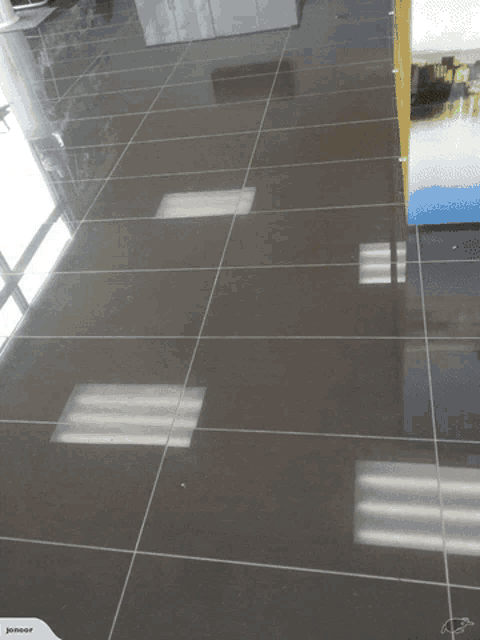 a picture of a tiled floor with the words central building visible