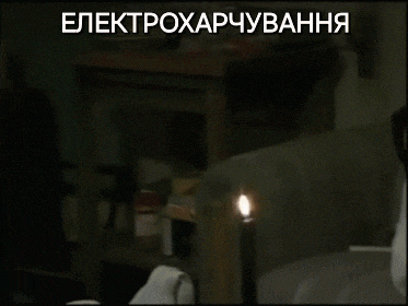 a person sitting in front of a lit candle with a caption that says " elektroxapyuvana "