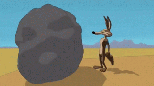 Coyote Pushing GIF - Coyote Pushing Rock GIFs