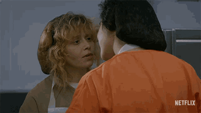 two women kissing with a netflix logo in the background