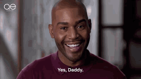 a bald man with a beard is smiling and saying `` yes , daddy '' .