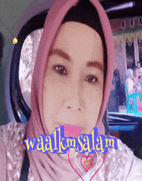a woman is wearing a pink hijab and the words waalkmsalam are on her face