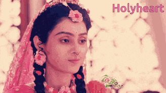 a close up of a woman 's face with the words holyheart in the background
