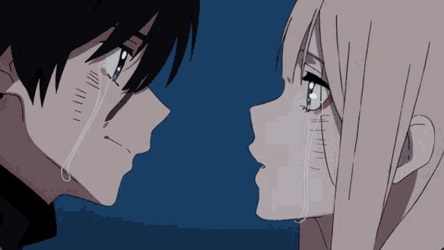 a man and a woman are looking at each other with tears coming out of their eyes