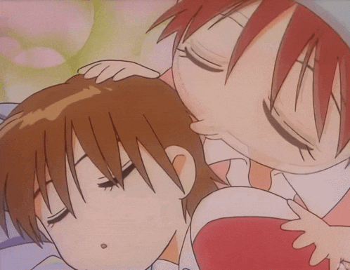 a cartoon of a girl kissing a boy on the forehead with cnix written on the bottom