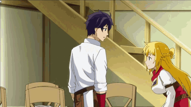 a man and a woman are standing next to each other in a room