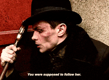 a man in a top hat is holding a gun with the words you were supposed to follow her below him