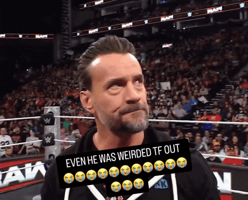 a man stands in front of a crowd with a sign that says even he was weirded tf out