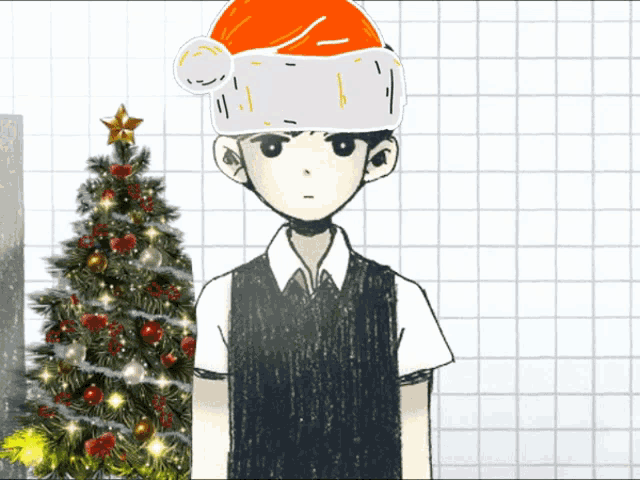 a boy wearing a santa hat stands next to a christmas tree