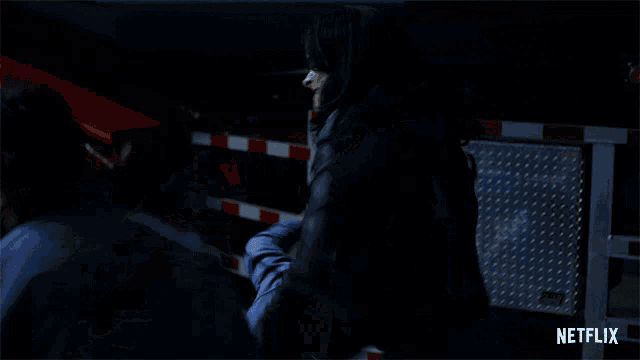 a netflix advertisement shows a man in a hooded jacket