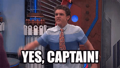a man in a tie is saying yes captain